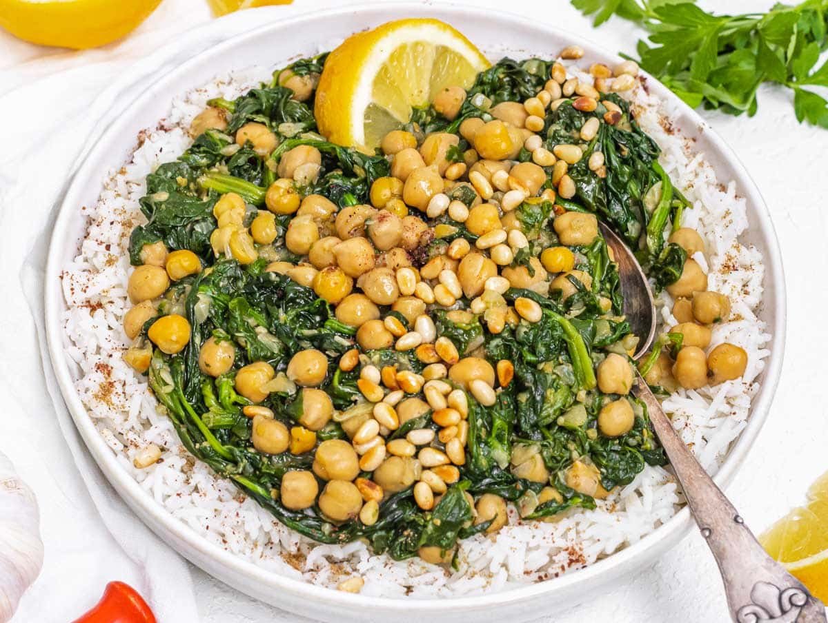 Chickpea Spinach Stew on rice with spoon
