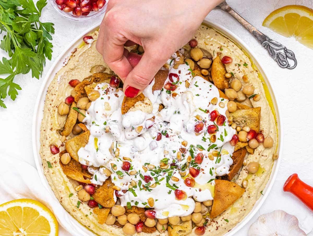 Fatteh with hand and red nails