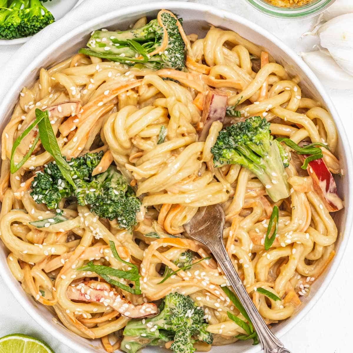 Peanut noodles with broccoli and sesame seeds
