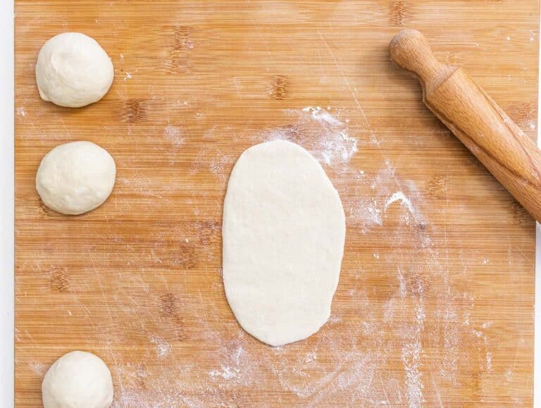 rolling pin and flat pita dough