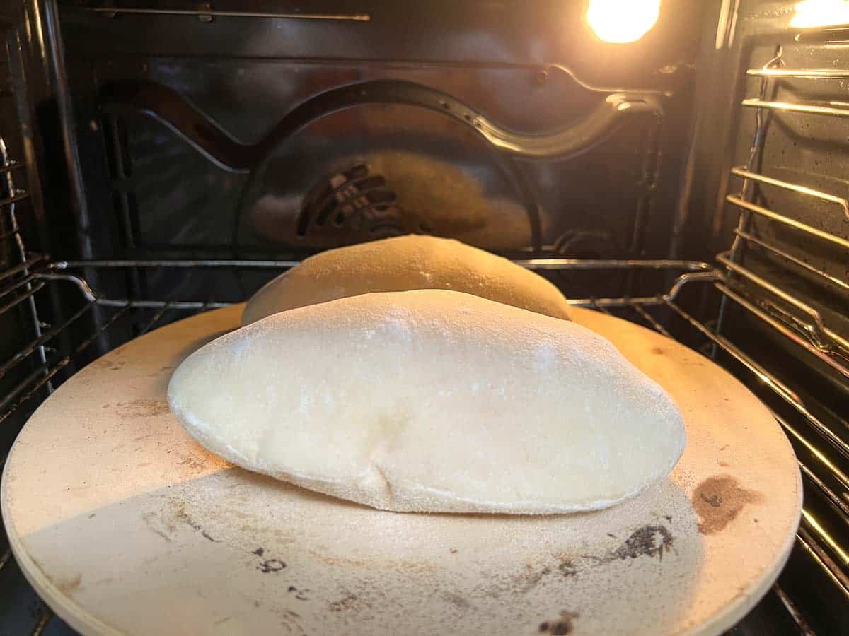 Pita in the oven on a pizza stone