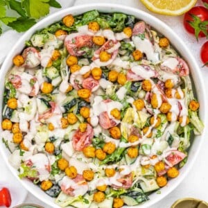 Tahini salad with dressing and half lemon