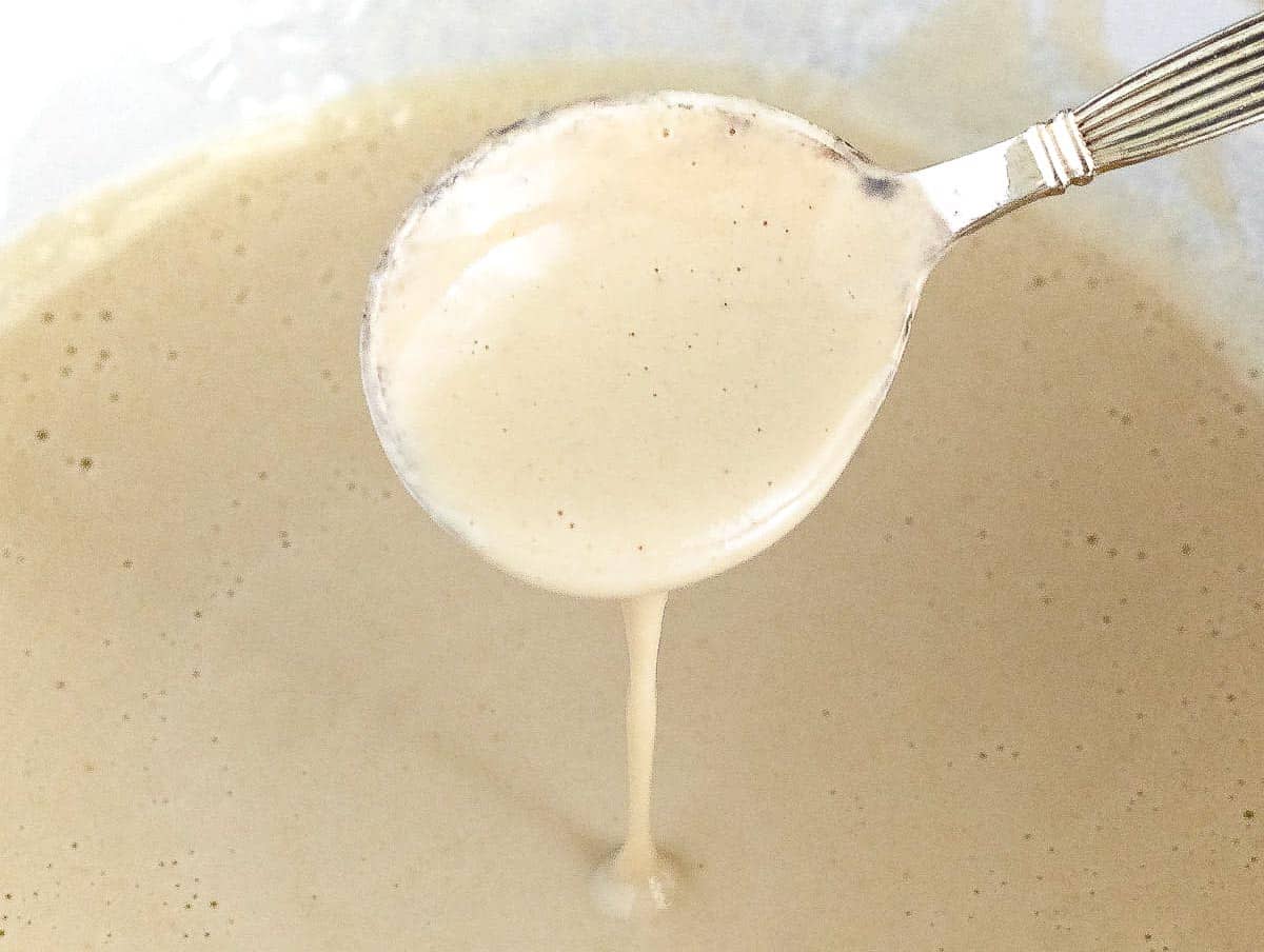 Tahini sauce and a small silver spoon