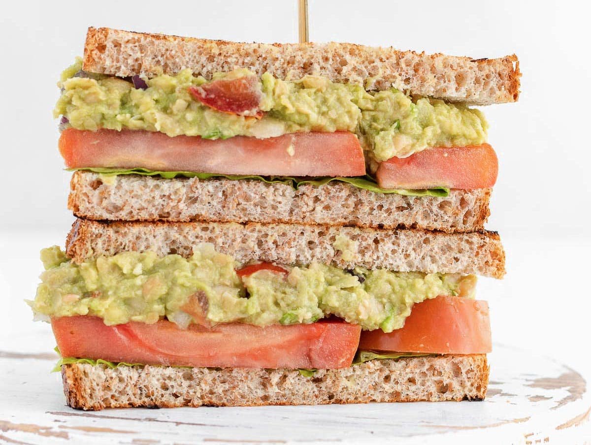 Guacamole with mashed chickpeas in a sandwich