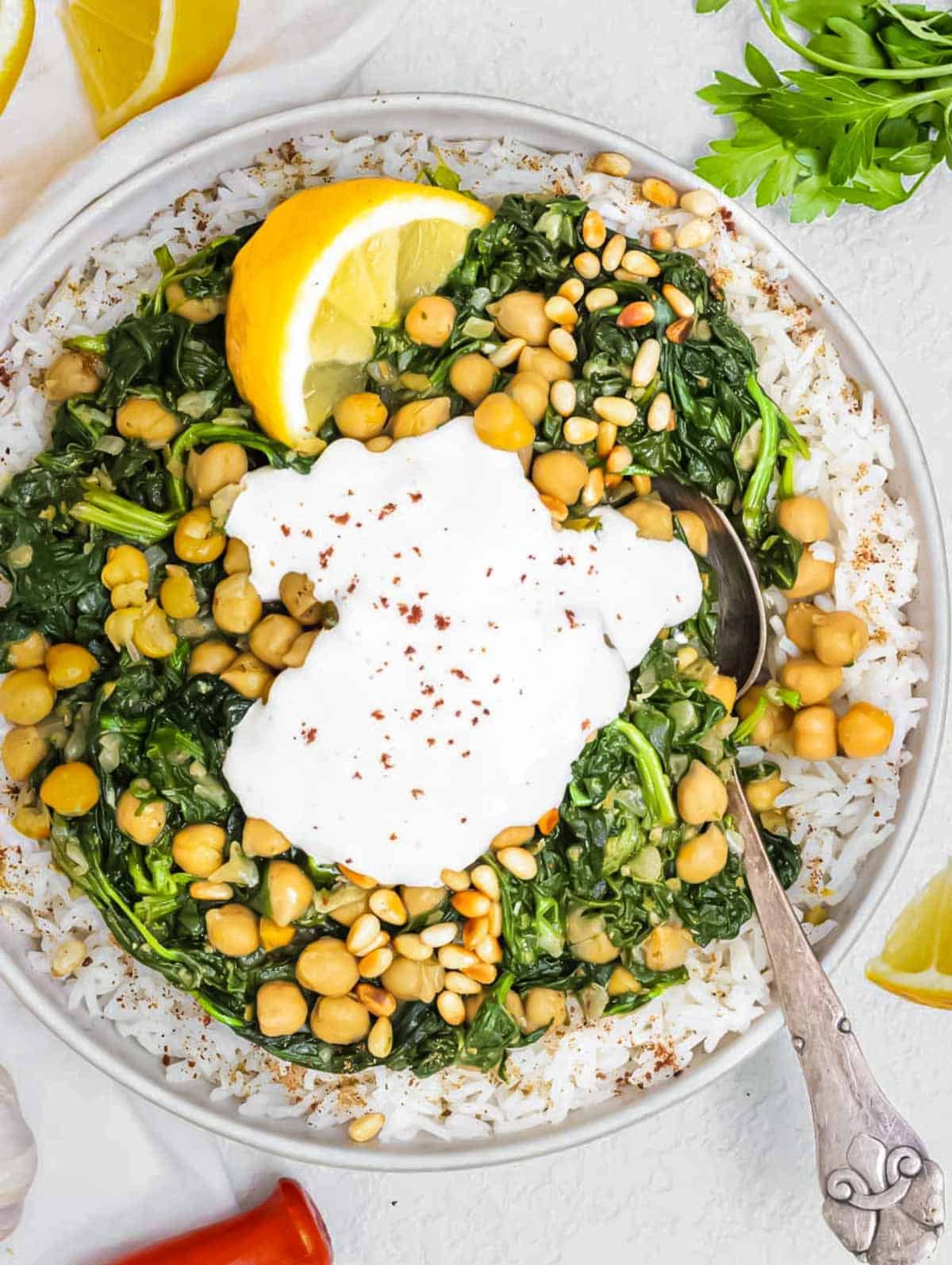 Spinach stew with chickpeas and yogurt sauce.
