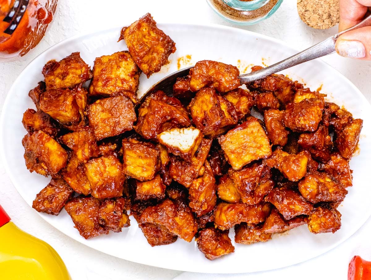 BBQ tofu with a spoon