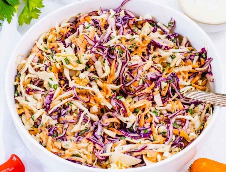 Coleslaw with cabbage and a spoon