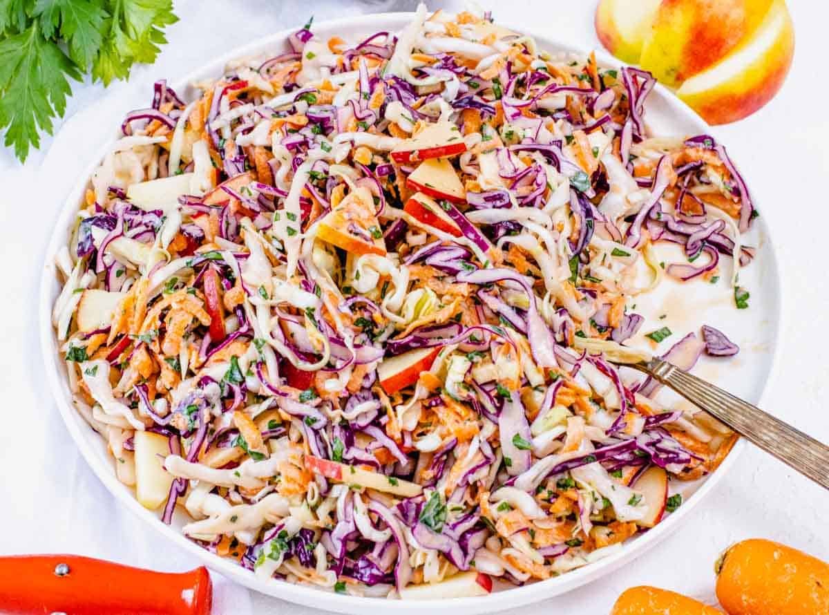 Coleslaw with red apple pieces