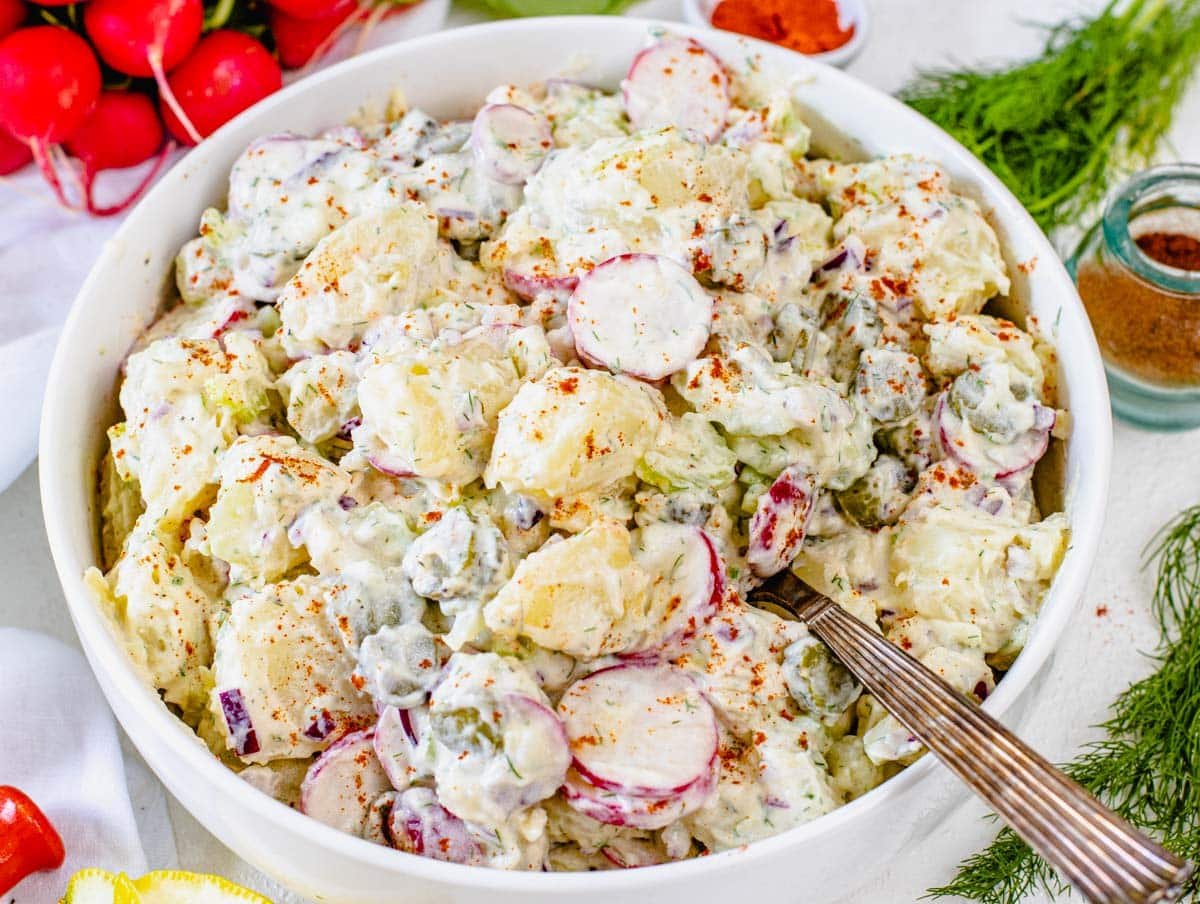 Dill Potato Salad with spoon and paprika