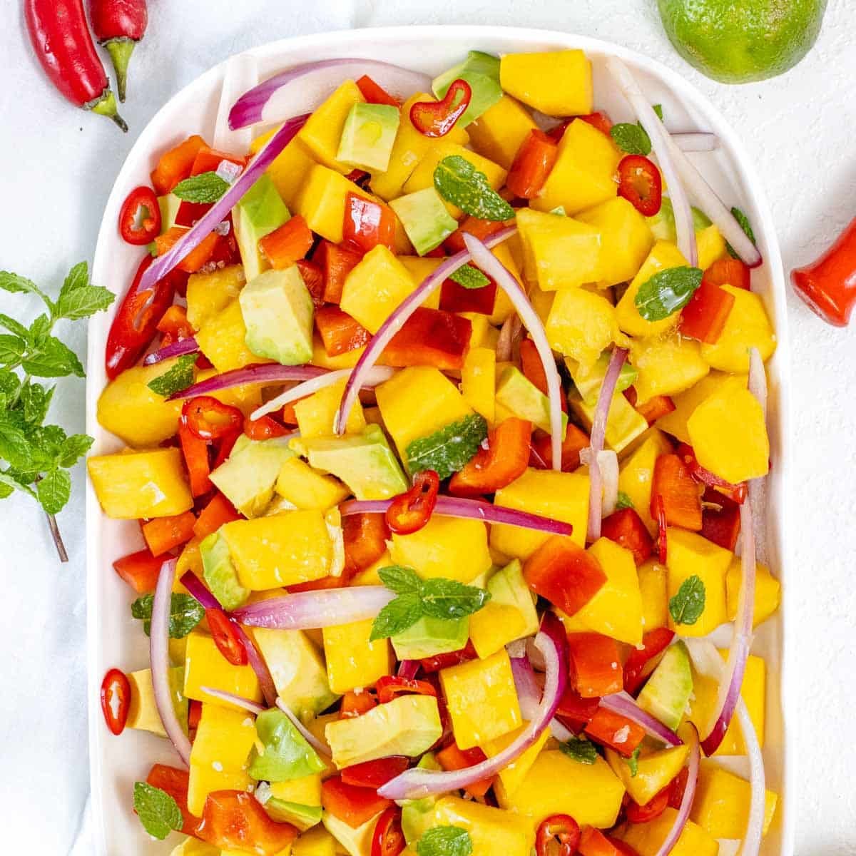 easy mango salad with avocado, lime, mint and bell pepper