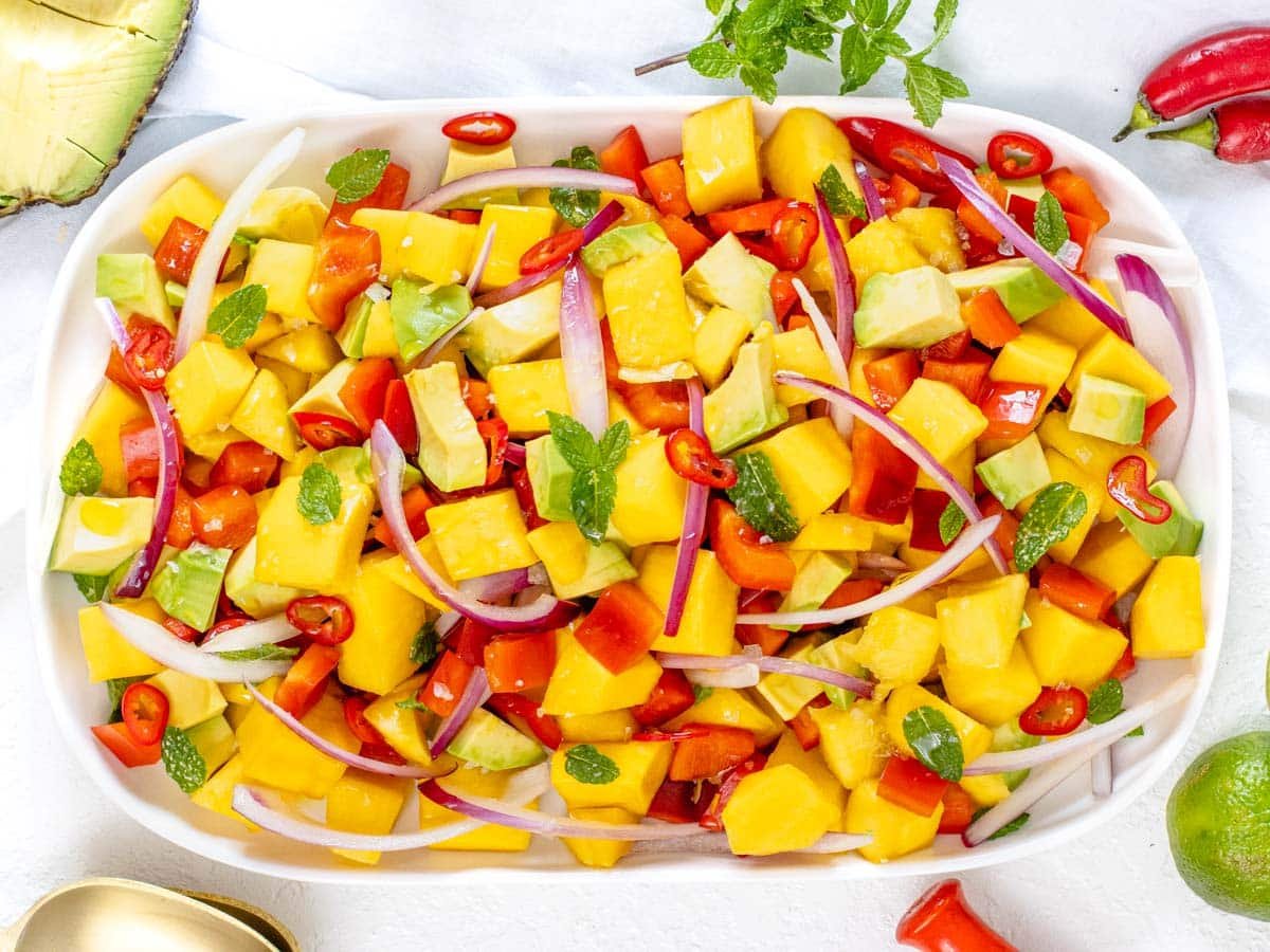 Mango salad on a white platter