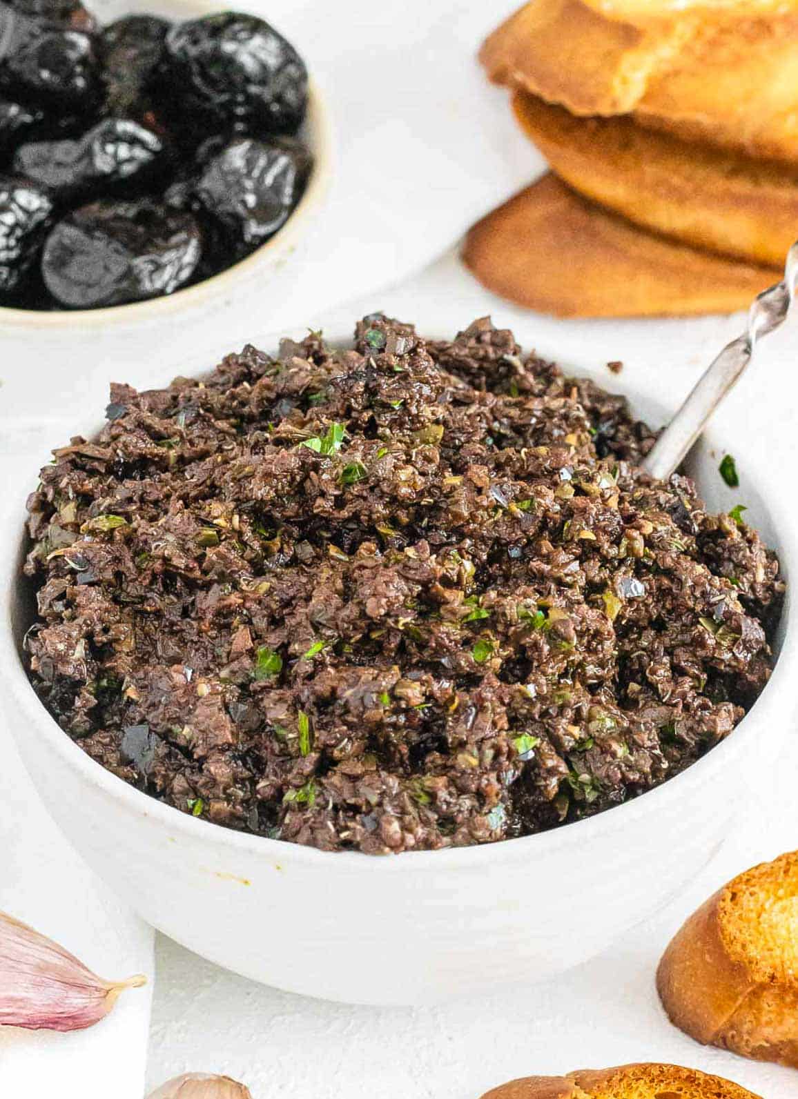 Olive tapenade in a white bowl