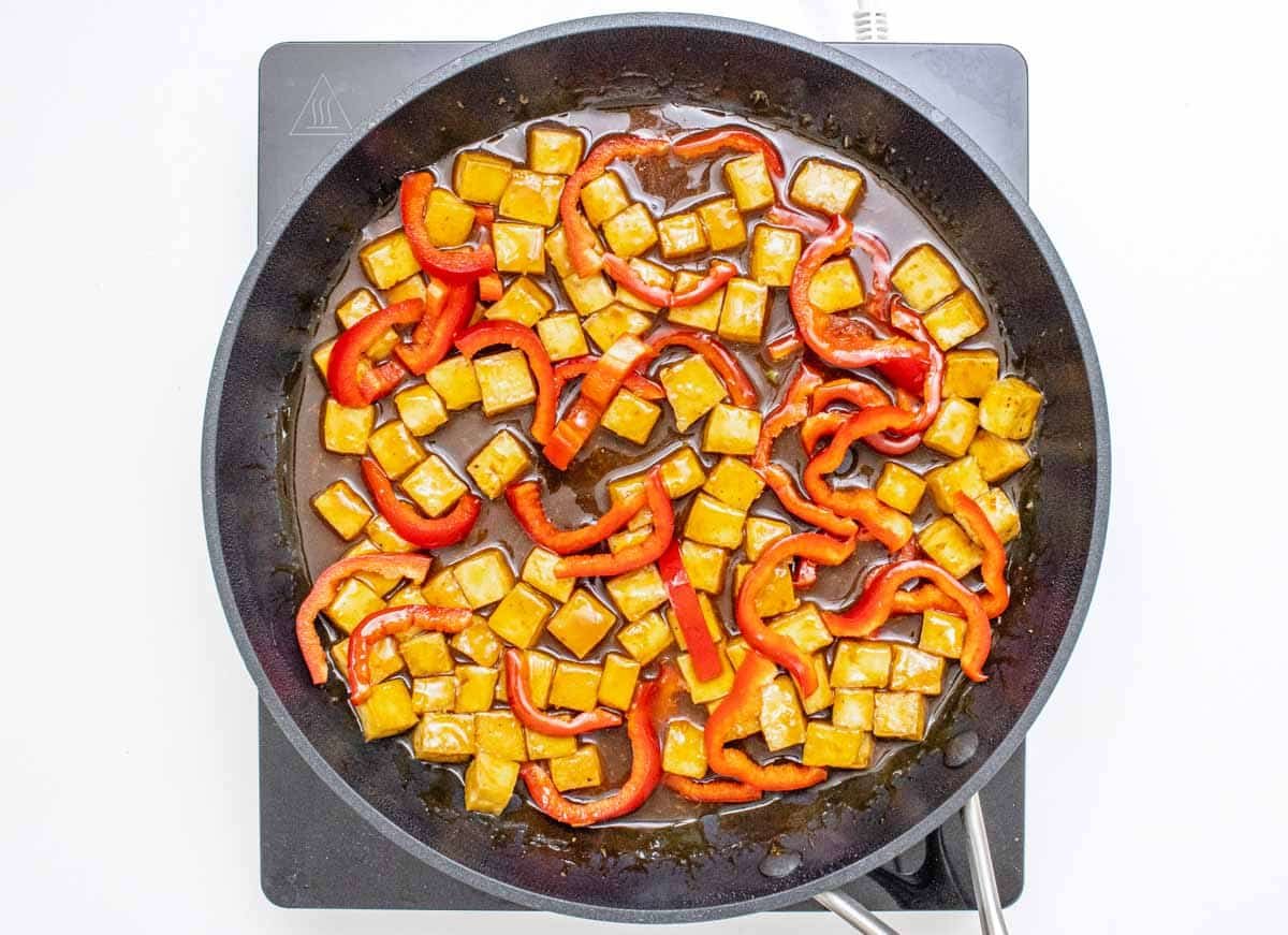 orange tofu and sliced bell peppers