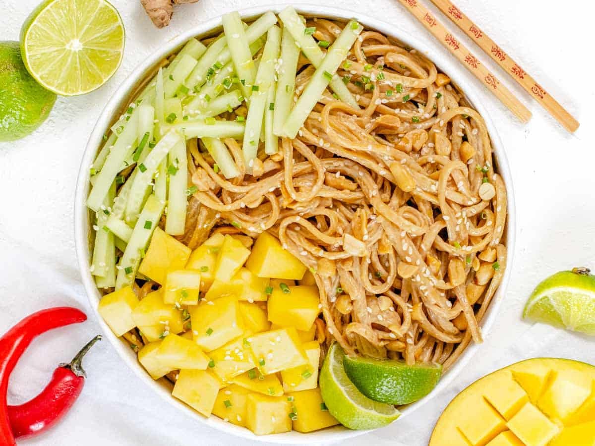 Sesame noodles with mango cubes and cucumber strips