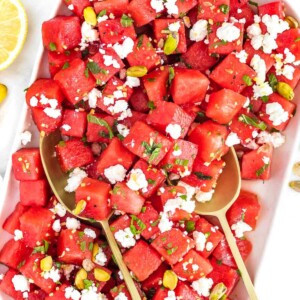 watermelon salad with feta on a white platter