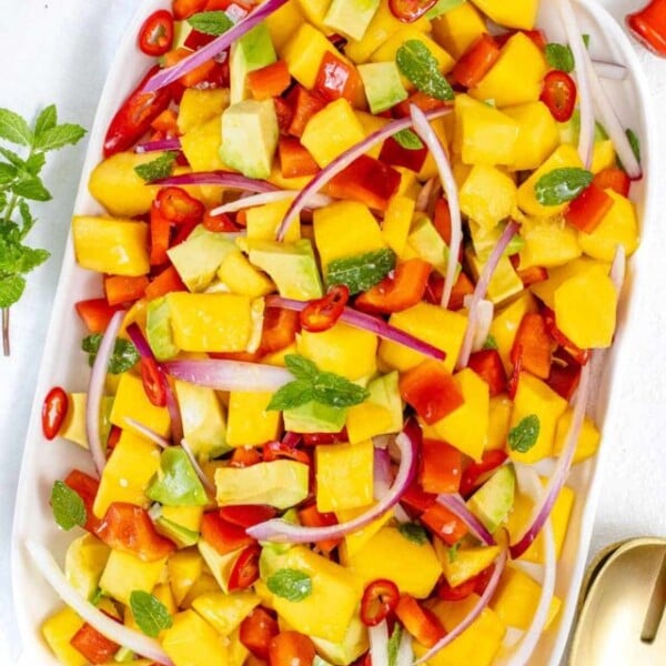 Mango salad on a white platter