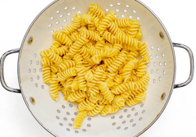 cooked pasta in colander
