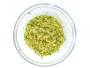 grated zucchini and sugar in a bowl