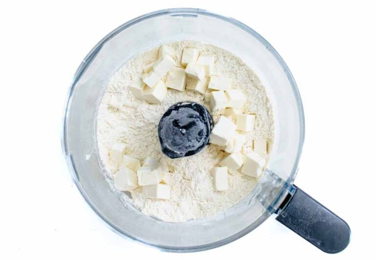 butter cubes and flour in a food processor
