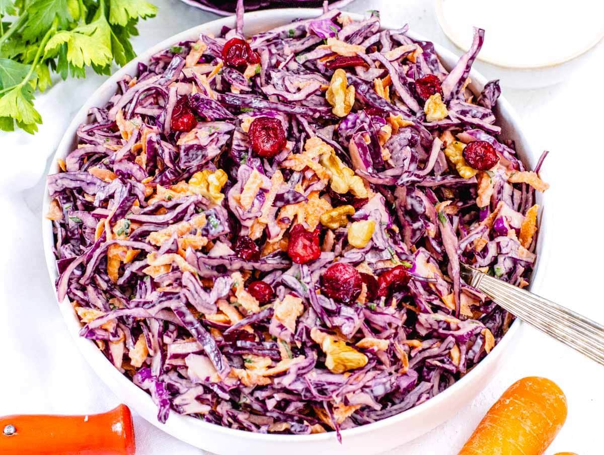 Creamy red cabbage slaw with cranberries