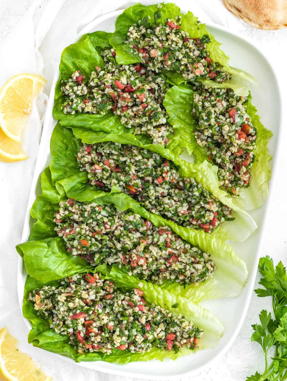 Tabbouleh on a platter with salad