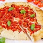 Tomato galette slice with ricotta and basil