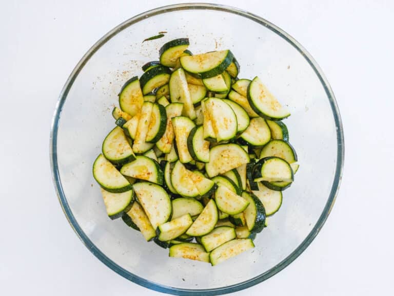 zucchini in a bowl with spices