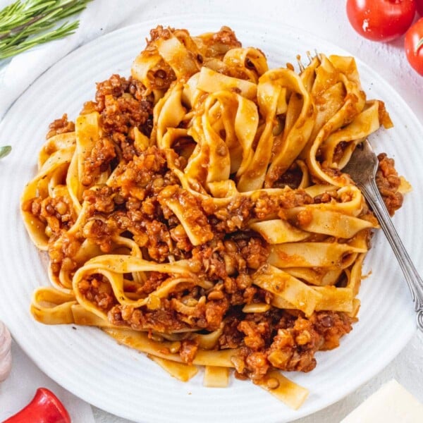 Lentil Bolognese on a plate with fork