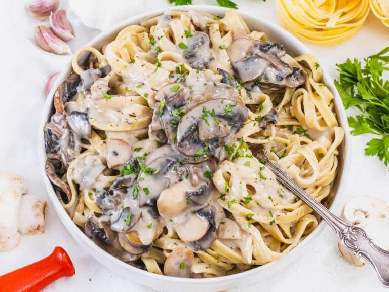 Mushroom Alfredo with fork and parsley