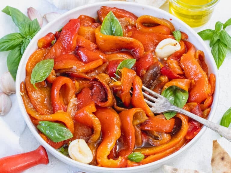 Roasted bell peppers with a fork