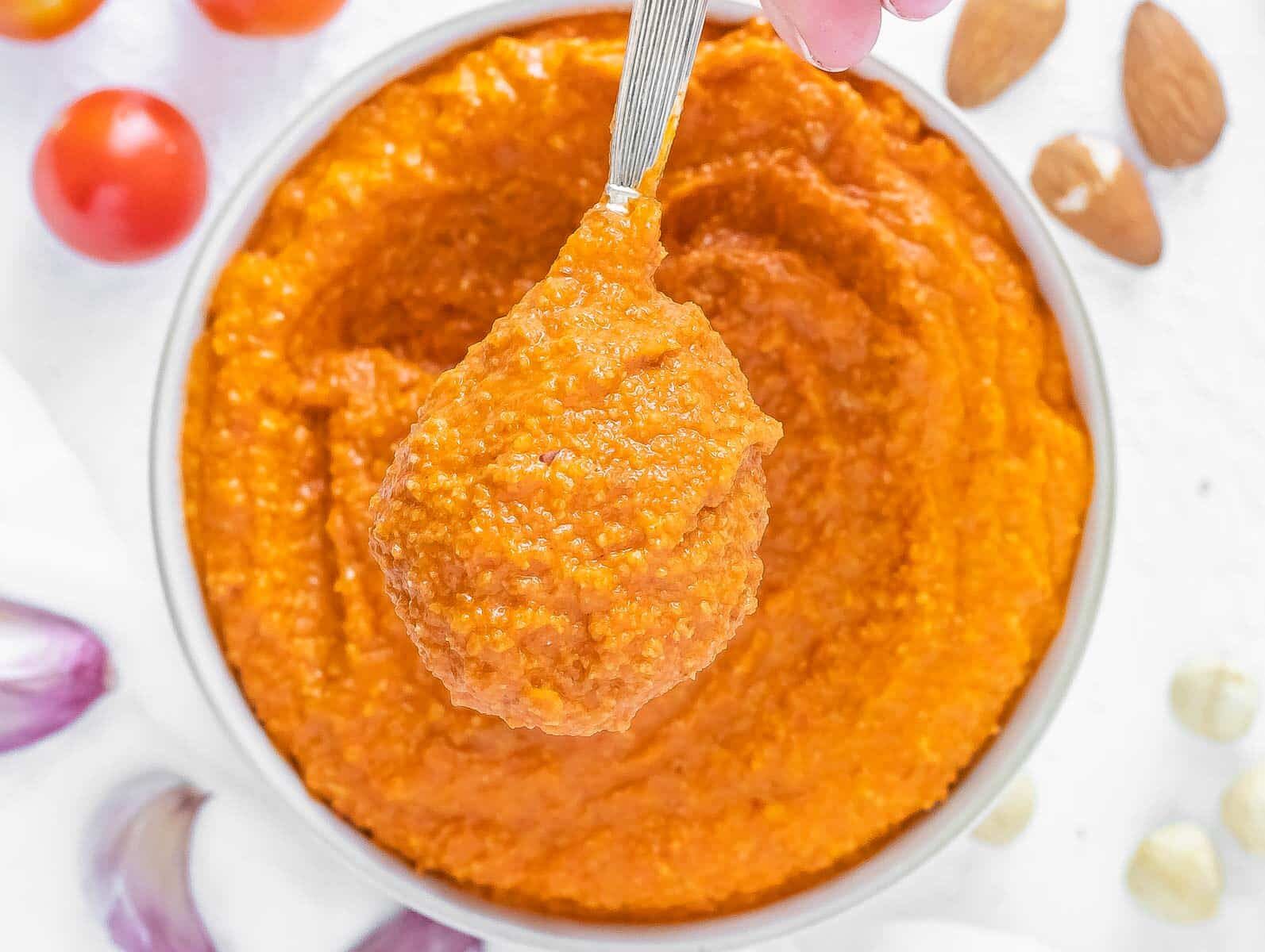 romesco sauce spooned out of a bowl