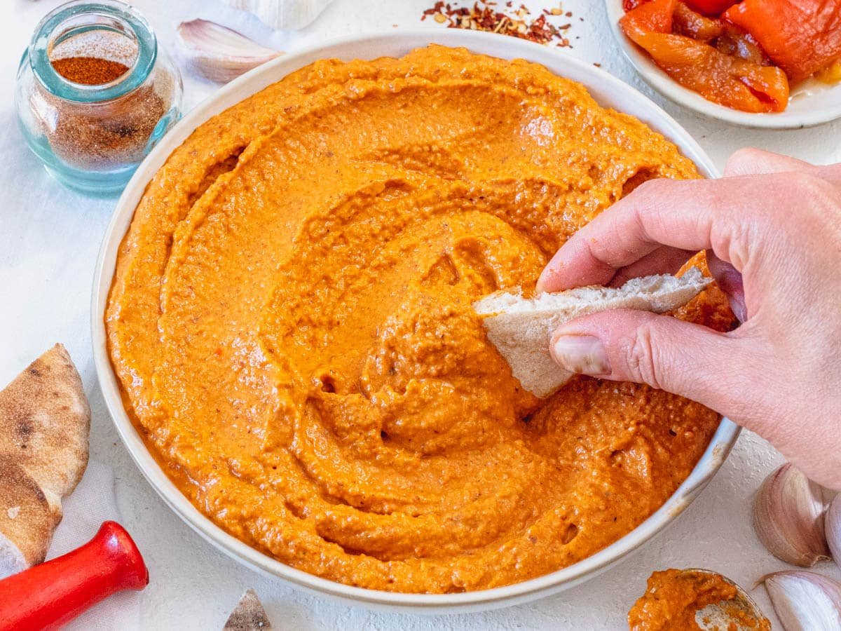Romesco recipe served as a dip with hand and pita bread