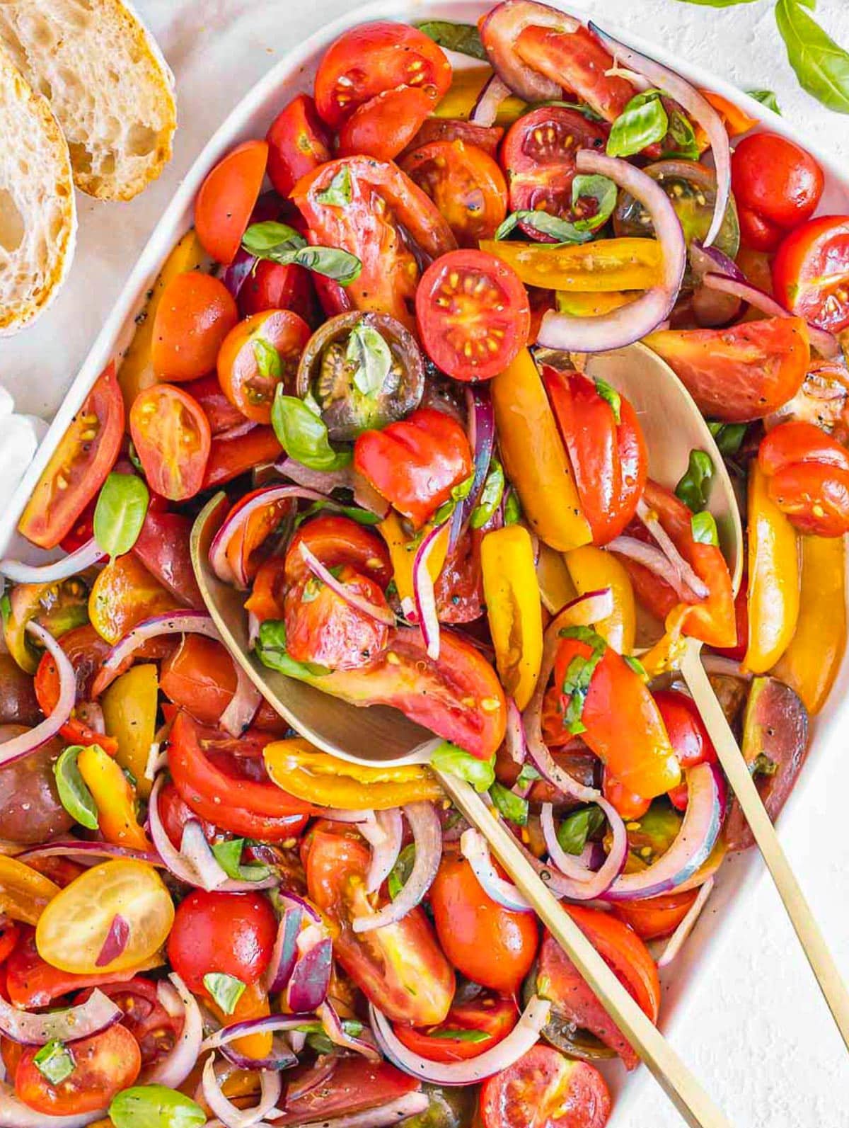 Tomato salad recipe on a white platter