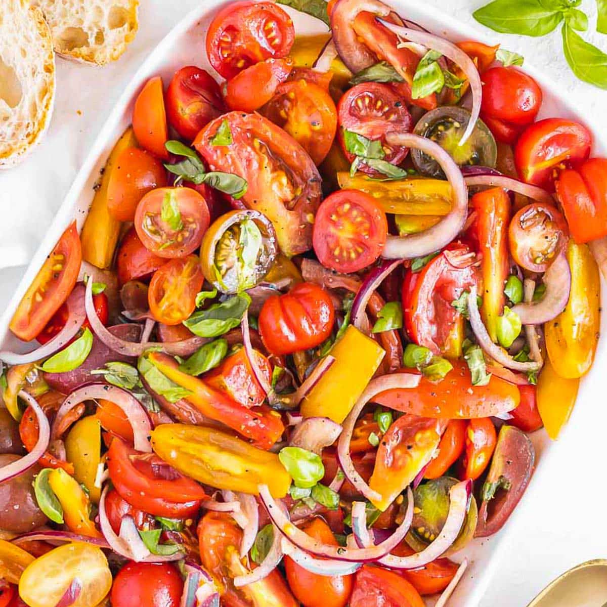 Tomato salad recipe with basil leaves