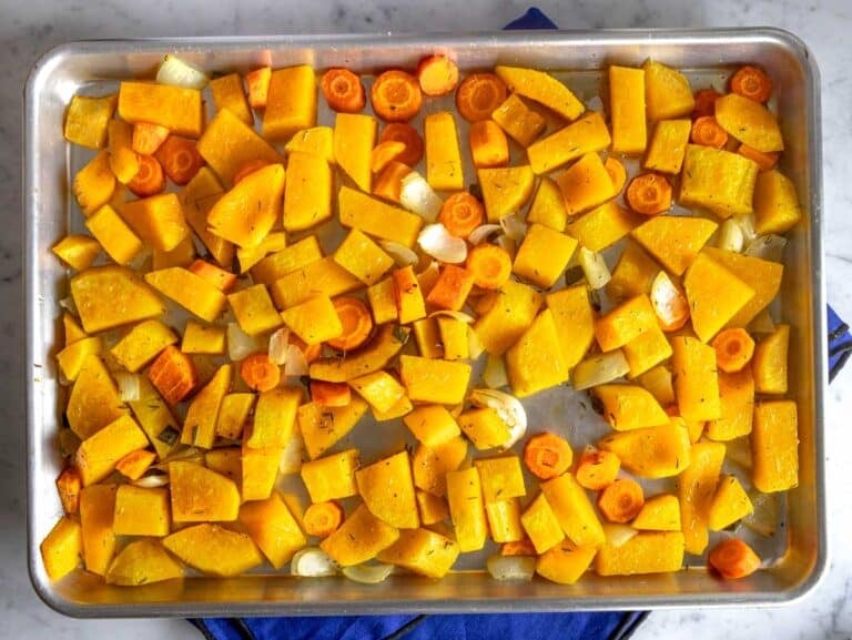 Roasted butternut squash and carrot on a baking tray