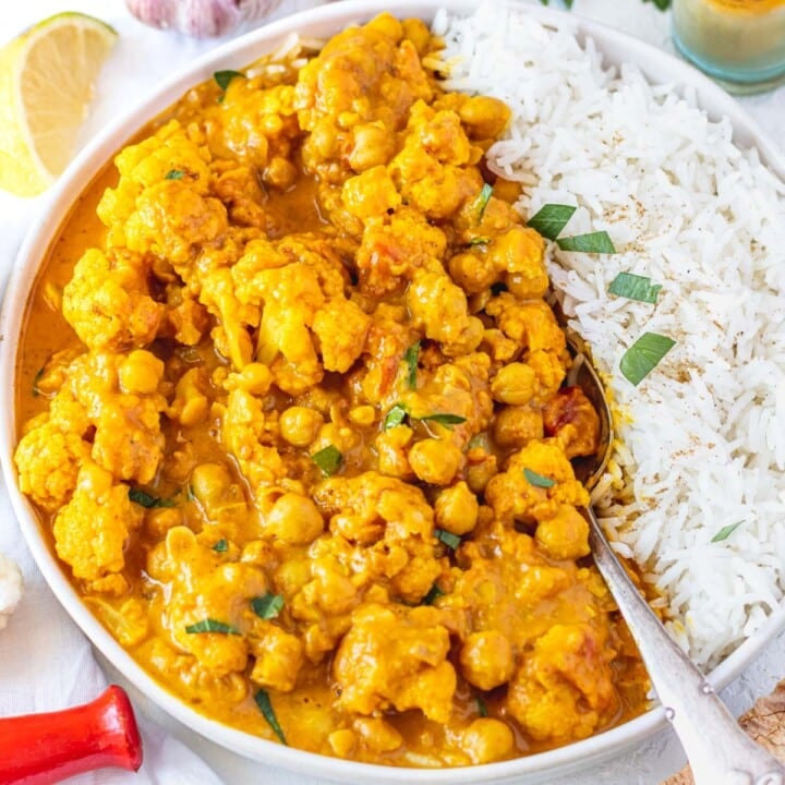 Cauliflower curry with rice and a spoon
