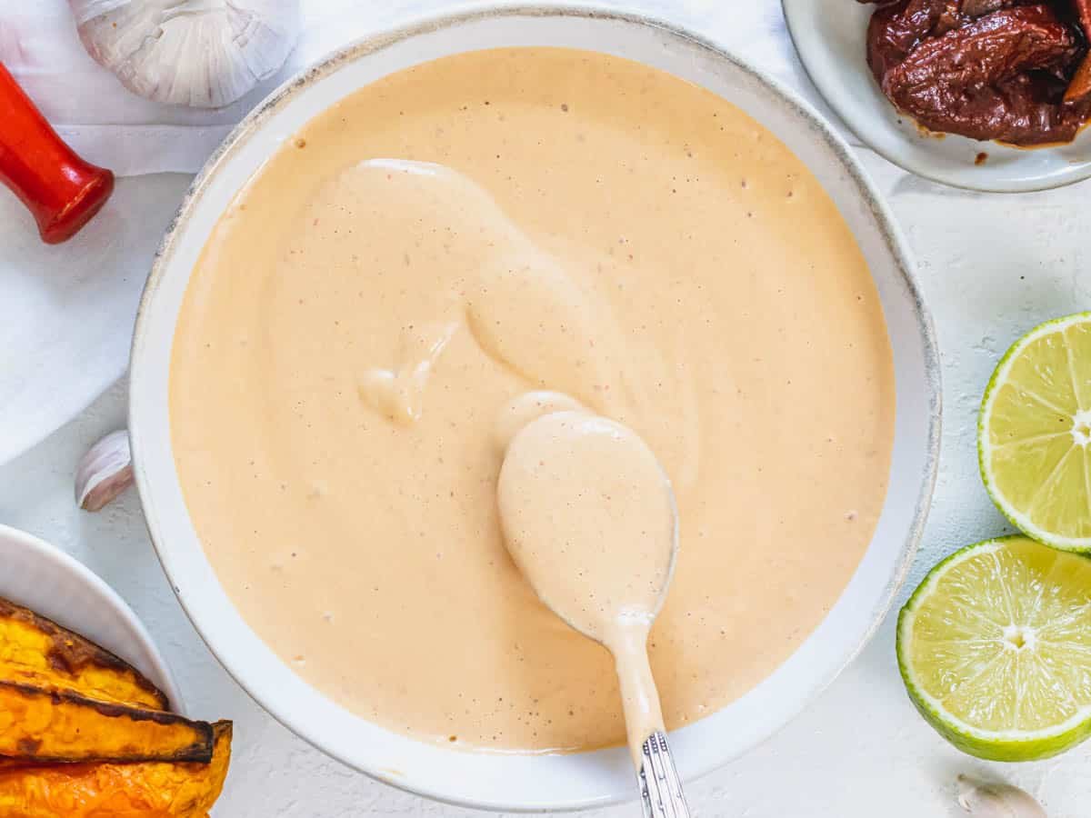 Chipotle sauce in a bowl with Mexican sides