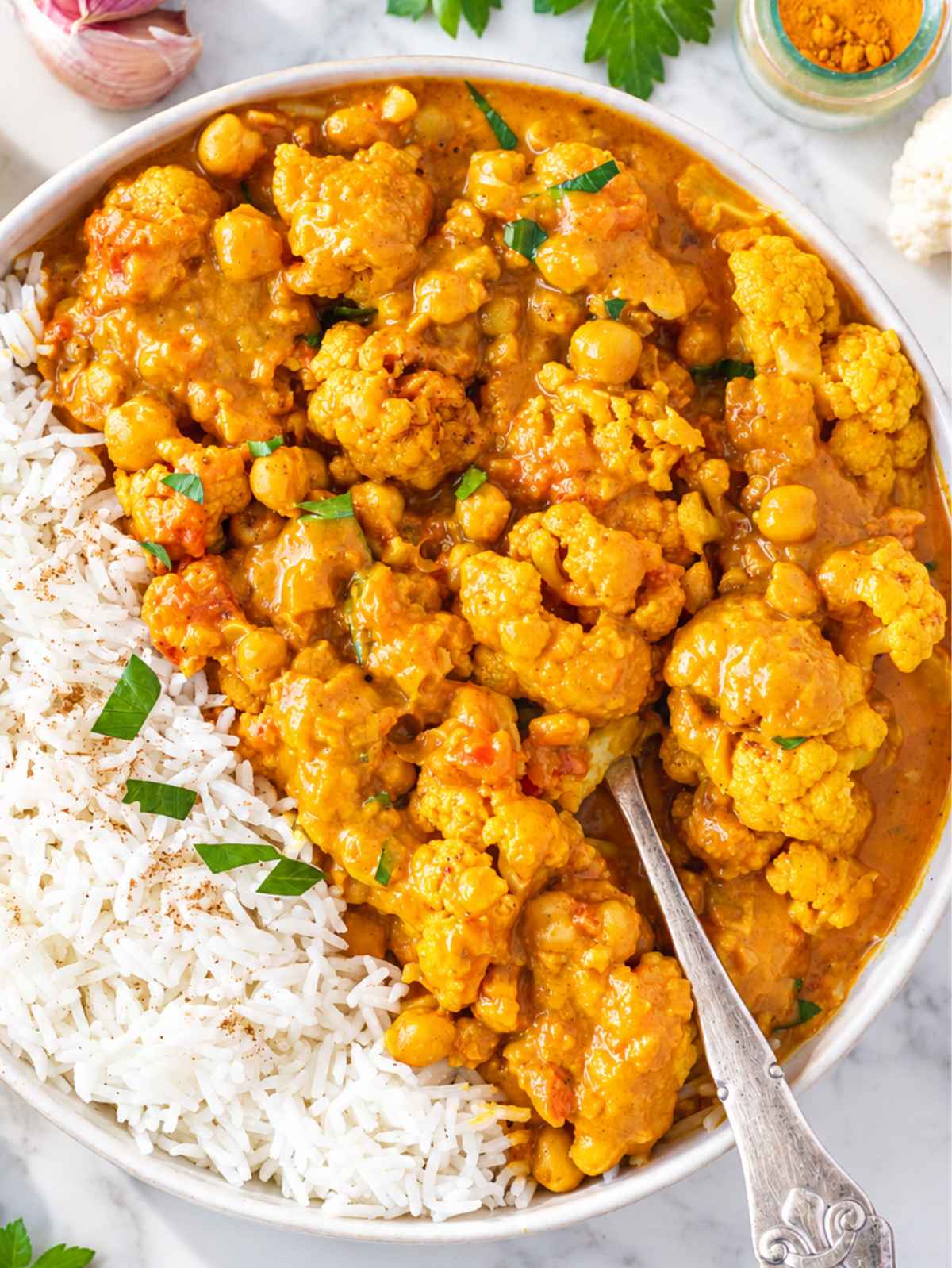 Creamy cauliflower curry with chickpeas, tender florets, and fresh cilantro.