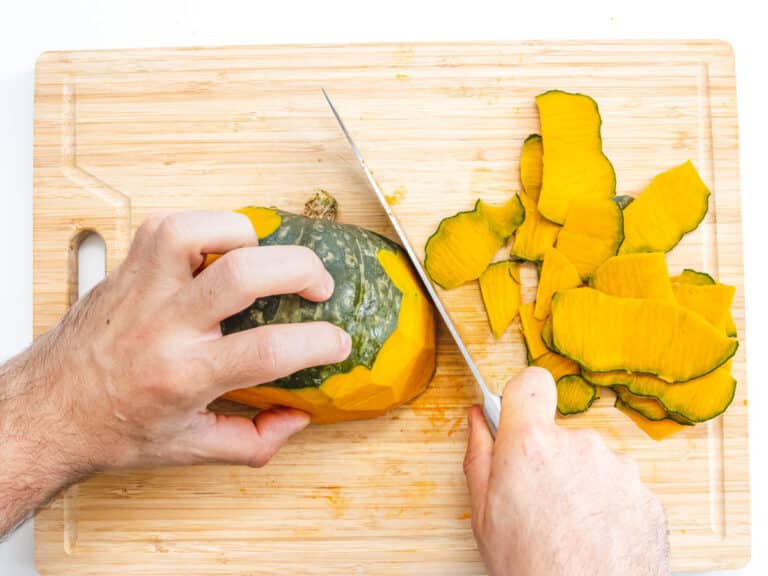 Kabocha with hands and a knife