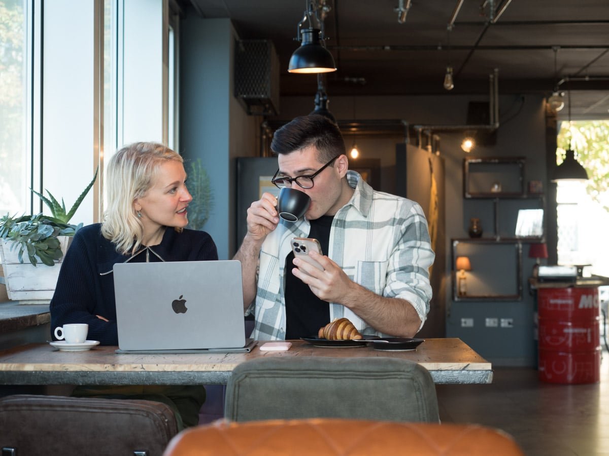 Louise and Nico drinking coffee and working hard