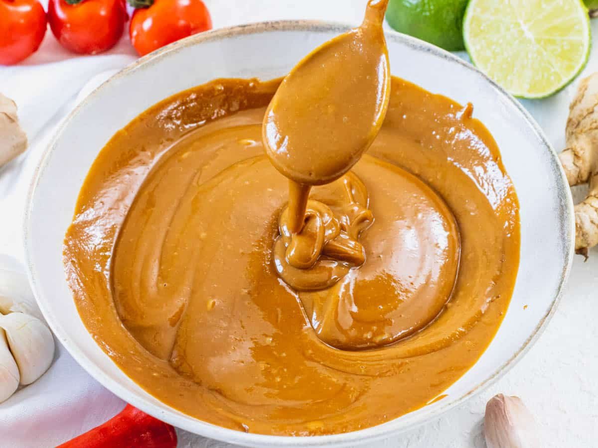 Creamy peanut sauce and a silver spoon