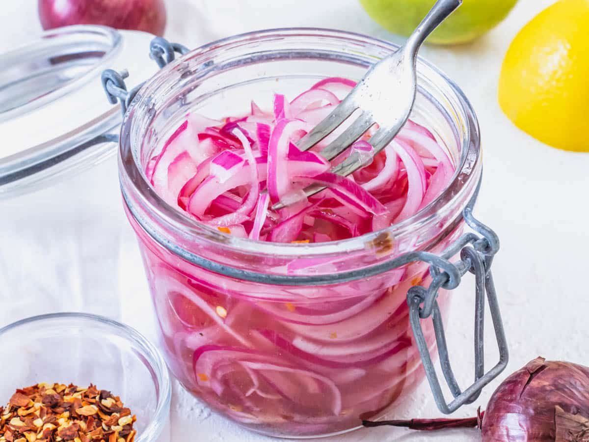 Pickled red onions in a glass jar