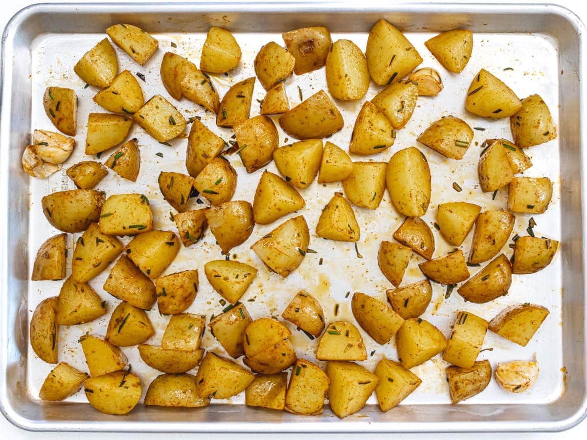 potatoes on a baking sheet before baking