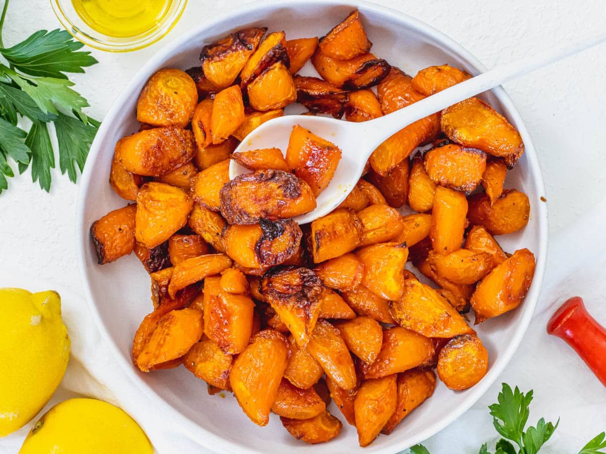 Roasted carrots in a white bowl