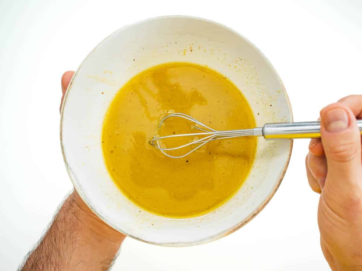 butternut squash salad dressing and hands