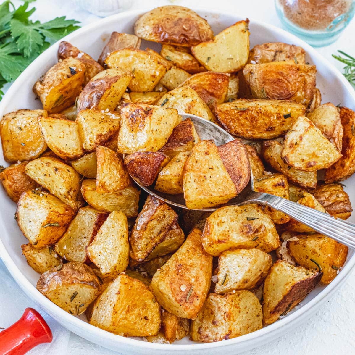 roasted potatoes and a silver spoon
