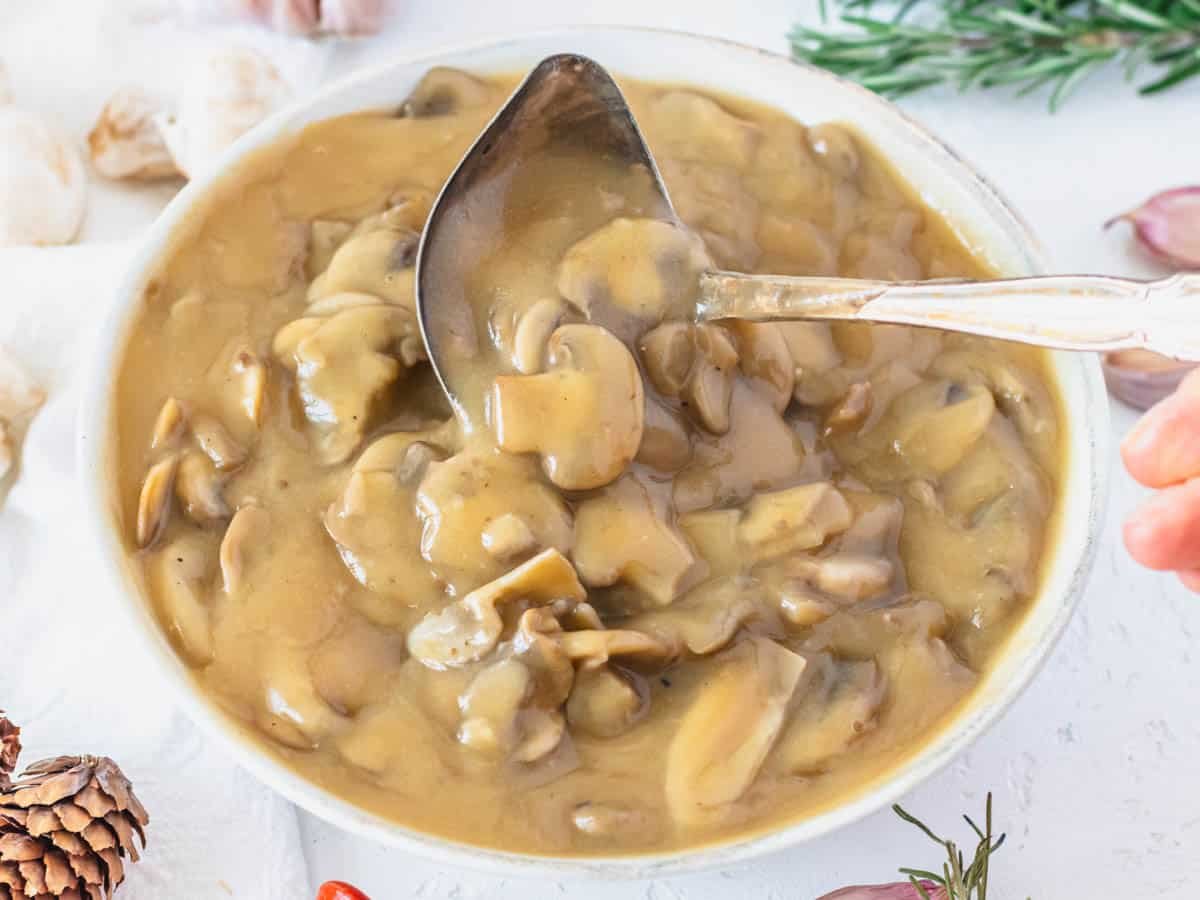 Mushroom gravy with garlic and rosemary on the side