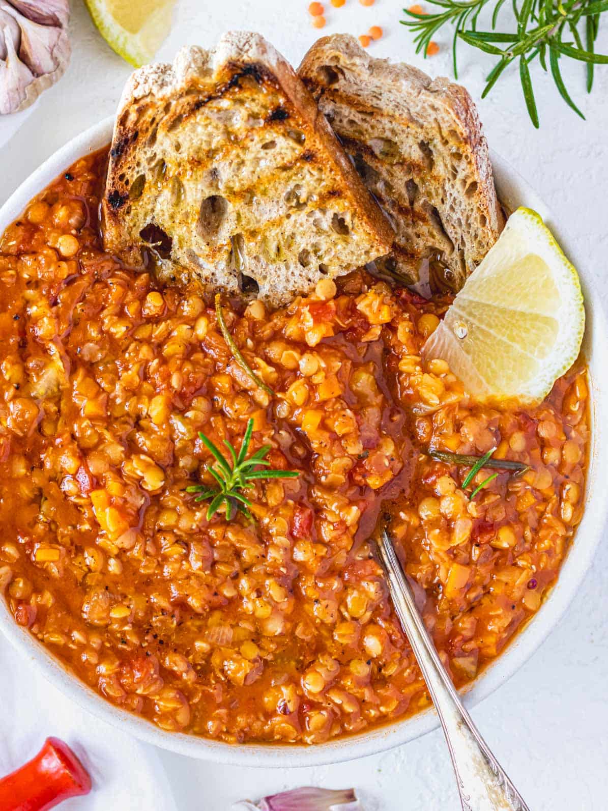Red lentil soup with a lemon wedge