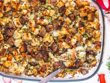 Vegetarian stuffing with a silver spoon and rosemary on the side
