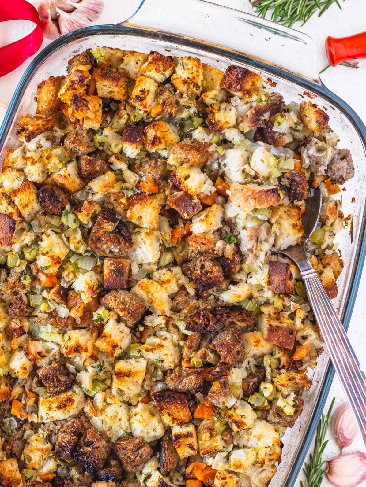 Vegetarian stuffing in a casserole with silver spoon